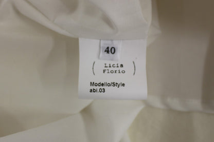 Abito da tè bianco con scollo all'americana e lunghezza al ginocchio di Licia Florio