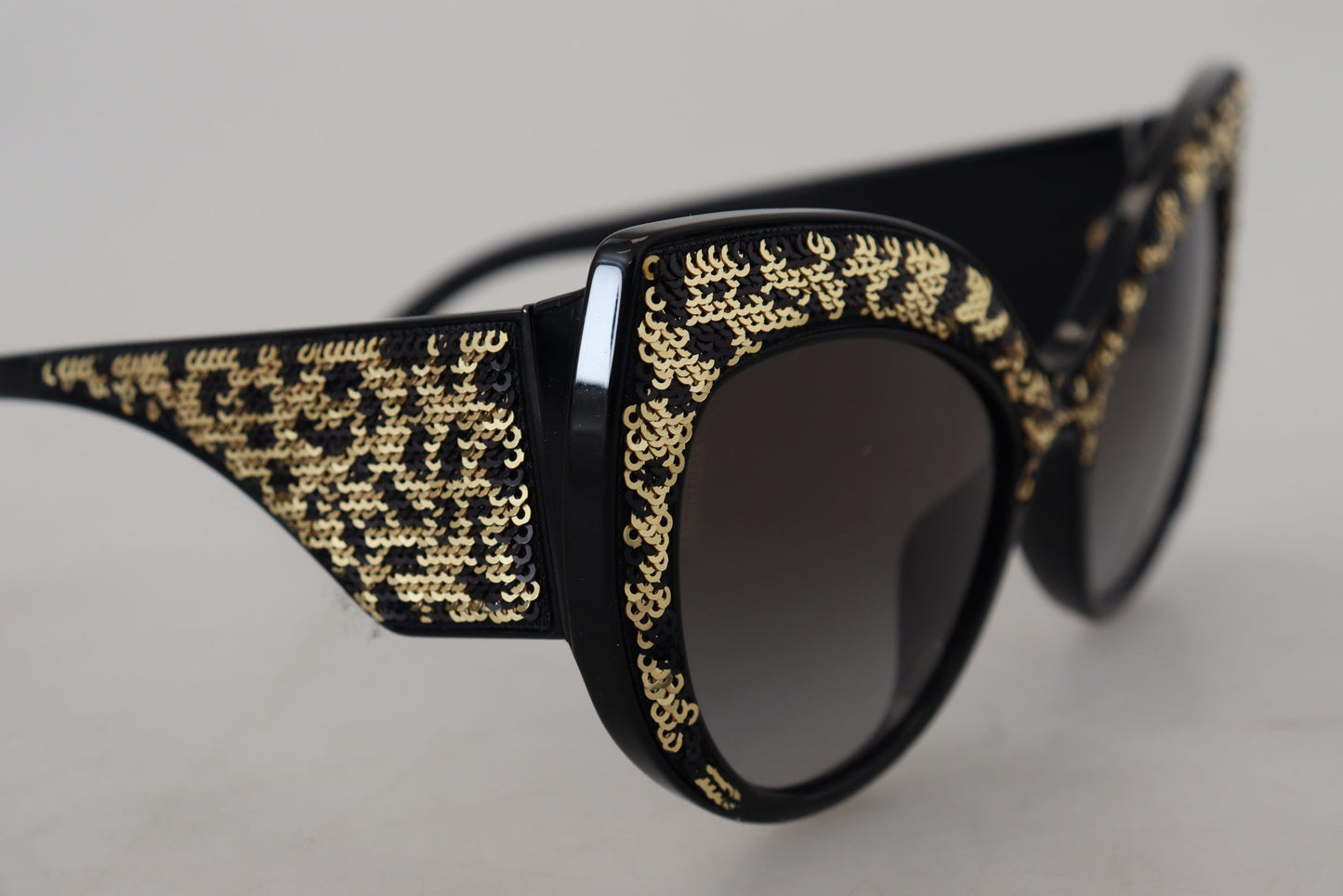 Occhiali da sole Dolce &amp; Gabbana DG4326 con lenti polarizzate a farfalla e paillettes nere e dorate