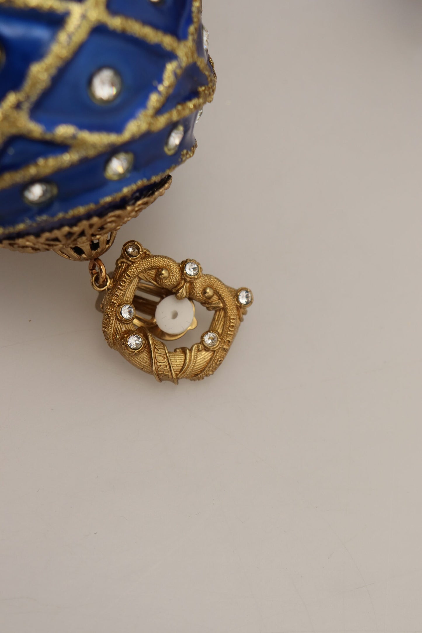 Orecchini a clip con cristalli pendenti blu in ottone dorato Dolce &amp; Gabbana