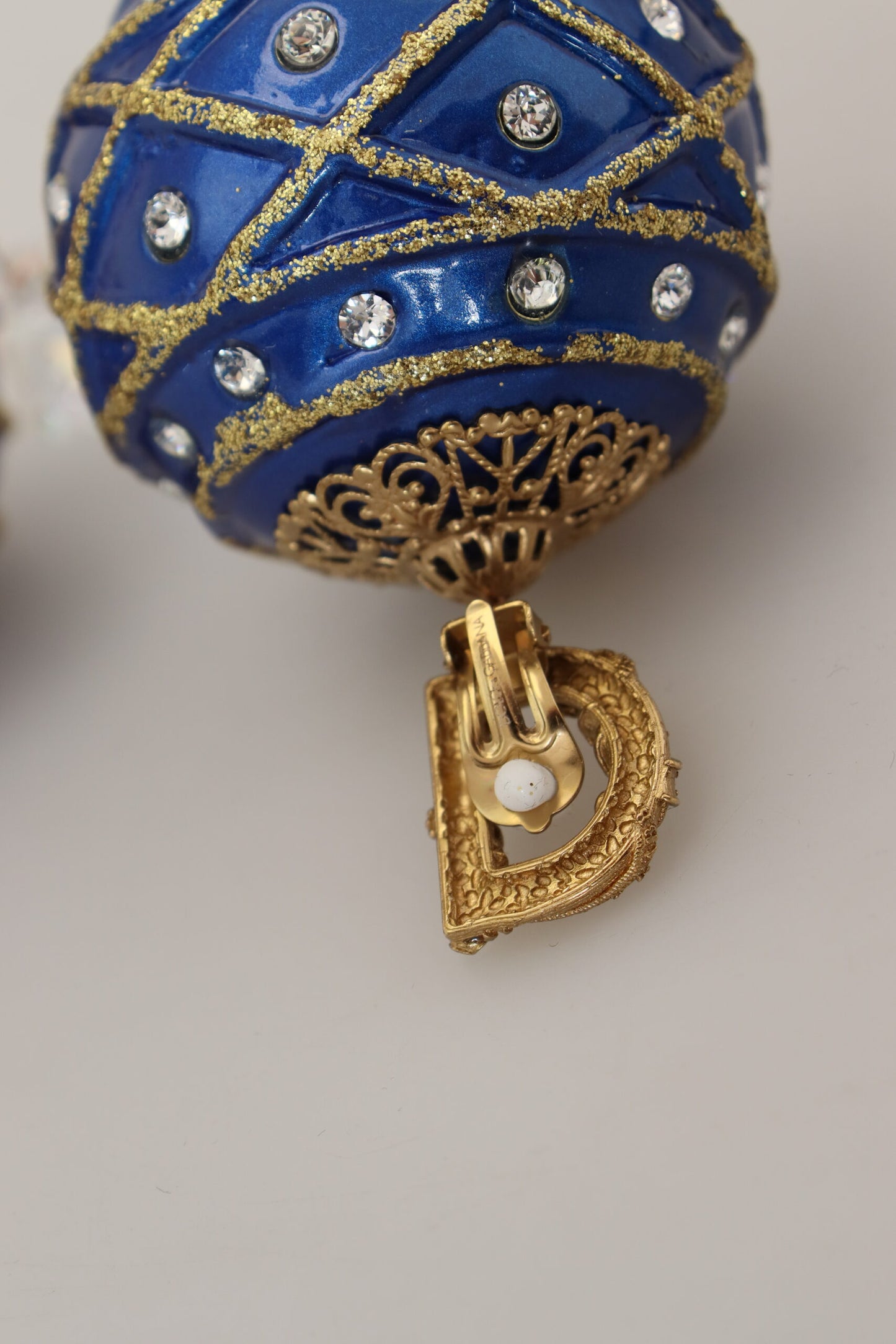 Orecchini a clip con cristalli pendenti blu in ottone dorato Dolce &amp; Gabbana