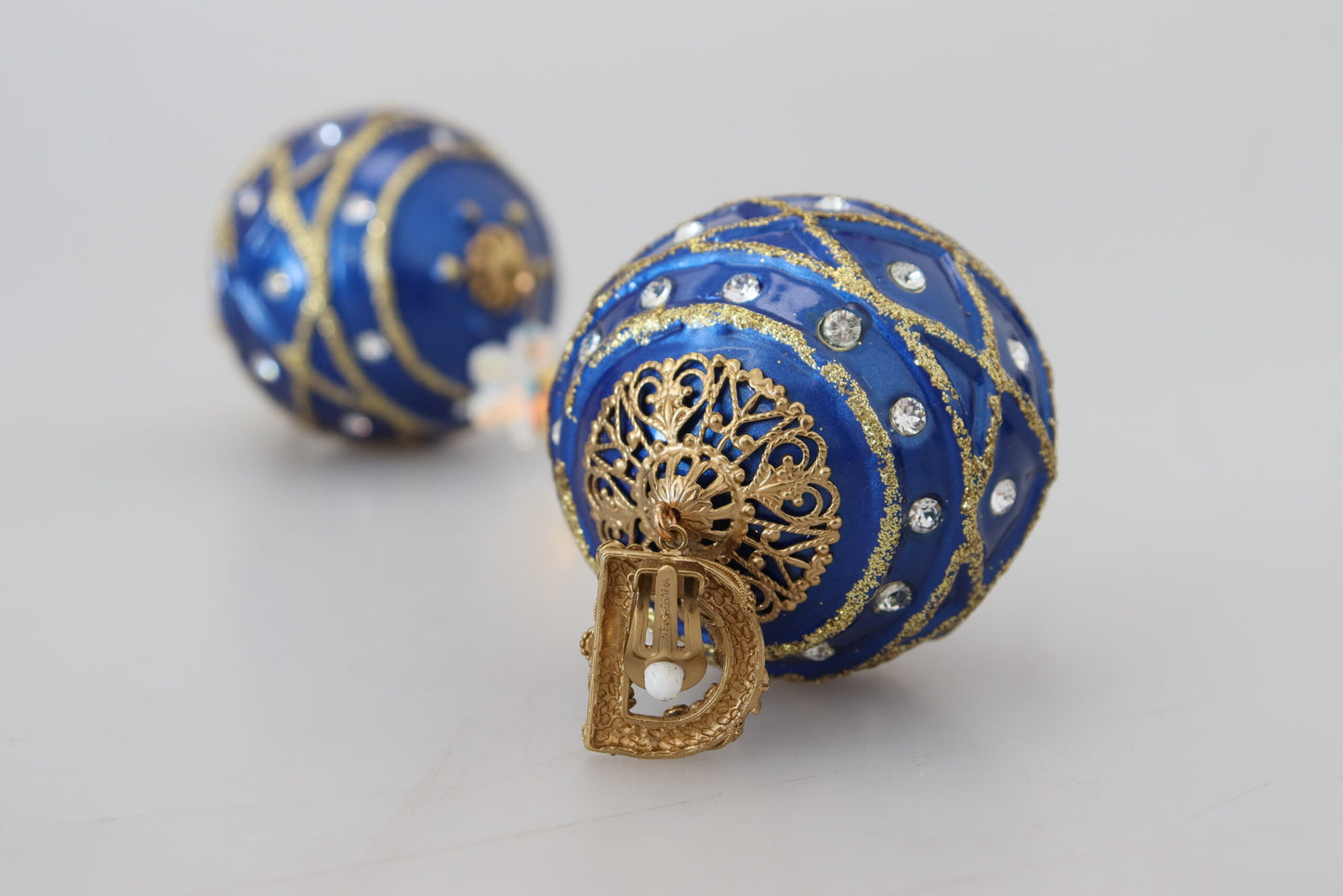 Orecchini a clip con cristalli pendenti blu in ottone dorato Dolce &amp; Gabbana
