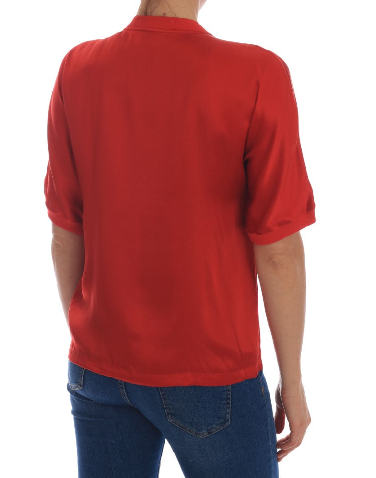 Blusa in seta rossa con cristalli floreali e arance di Dolce &amp; Gabbana