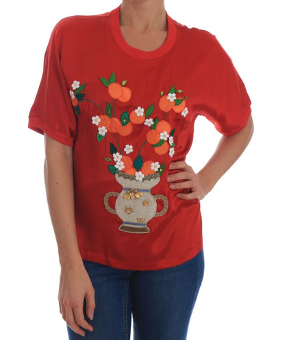 Blusa in seta rossa con cristalli floreali e arance di Dolce &amp; Gabbana