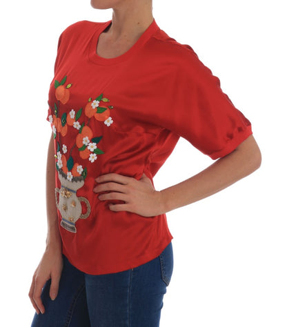Blusa in seta rossa con cristalli floreali e arance di Dolce &amp; Gabbana