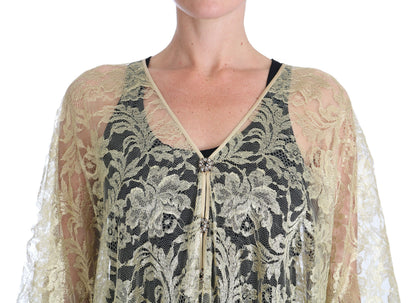 Abito con mantella in pizzo floreale dorato e cristalli di Dolce &amp; Gabbana