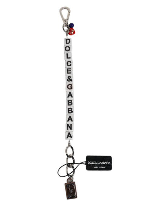 Bracciale Dolce & Gabbana con ciondolo decorato con logo a dadi e catena in ottone argentato