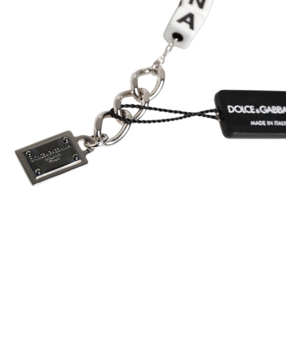 Bracciale Dolce &amp; Gabbana con ciondolo decorato con logo a dadi e catena in ottone argentato