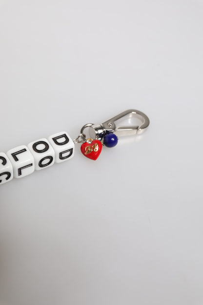 Bracciale Dolce &amp; Gabbana con ciondolo decorato con logo a dadi e catena in ottone argentato