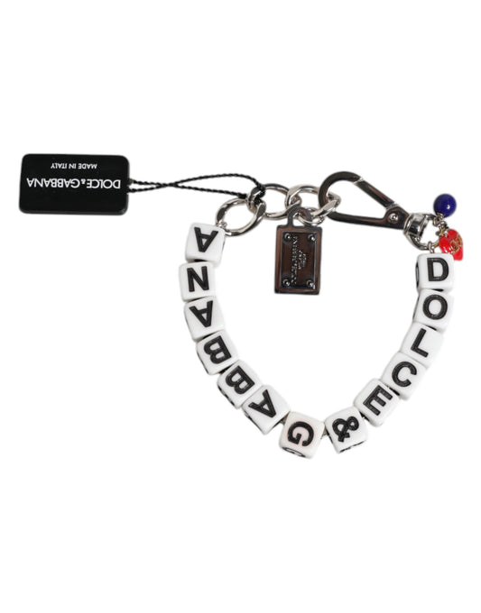 Bracciale Dolce &amp; Gabbana con ciondolo decorato con logo a dadi e catena in ottone argentato