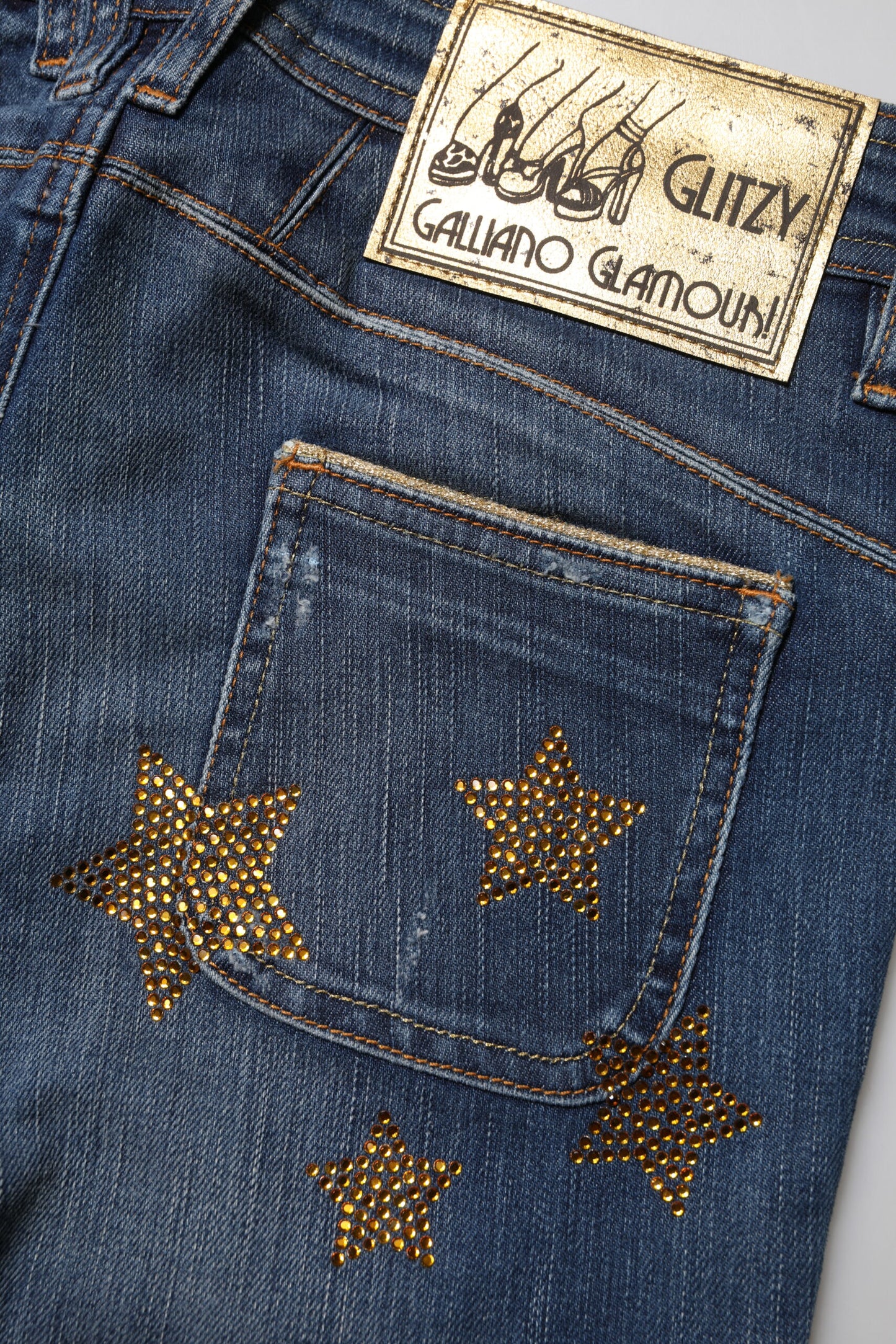 Jeans John Galliano in cotone blu a vita media e gamba larga